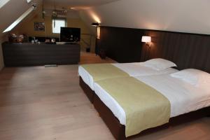 Voodi või voodid majutusasutuse Cleythil Hotel toas