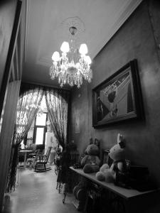 a room with a chandelier and stuffed animals on a table at Angel Wings Inn in Hualien City