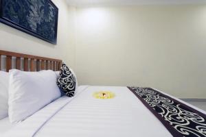 Postel nebo postele na pokoji v ubytování Pondok Mundeh Ubud