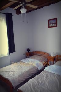 Ένα ή περισσότερα κρεβάτια σε δωμάτιο στο Piszkeri Vendégház - Cece +15 φωτογραφίες