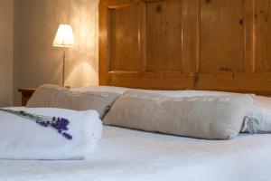 Postel nebo postele na pokoji v ubytování Agriturismo Maso Lizzone