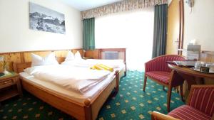 Łóżko lub łóżka w pokoju w obiekcie Familien- & Vitalhotel Auenhof