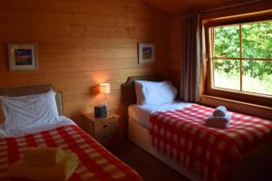 Postel nebo postele na pokoji v ubytování Saplinbrae Hotel and Lodges
