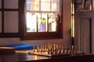 a chess set on top of a wooden table at Vagia Traditional, Aegina Island in Vaia