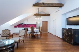 a dining room with a table and chairs at Apartman Marica in Orebić