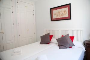 Posteľ alebo postele v izbe v ubytovaní Apartamento Buhaira