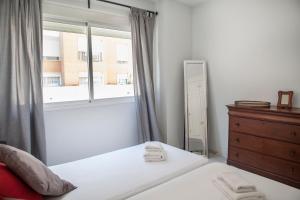 Posteľ alebo postele v izbe v ubytovaní Apartamento Buhaira