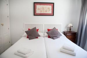 Posteľ alebo postele v izbe v ubytovaní Apartamento Buhaira