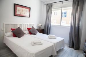 Posteľ alebo postele v izbe v ubytovaní Apartamento Buhaira