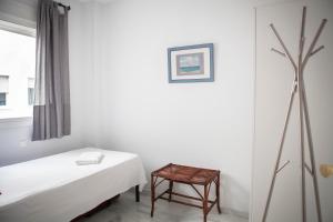 Posteľ alebo postele v izbe v ubytovaní Apartamento Buhaira