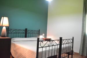 Ein Bett oder Betten in einem Zimmer der Unterkunft Culla del Barocco