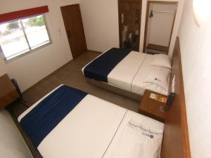 Postel nebo postele na pokoji v ubytování Hotel Star