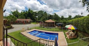 a playground with a small pool and a playground at Hotel Campestre Alto Bonito del Quindío in El Cuzco