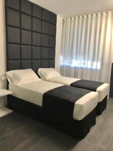 Postel nebo postele na pokoji v ubytování Hotel Pex Padova