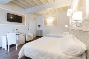 Postel nebo postele na pokoji v ubytování Hotel California