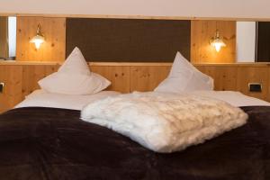 Letto o letti in una camera di Hotel Chalet Olympia