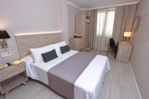Cama o camas de una habitación en Hotel Villa de Verín