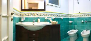a bathroom with a sink and a toilet at Gogas Amalfi Coast in Cetara +26 photos