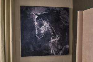 a painting of a horse on a wall at Revere Hotel Boston Common in Boston