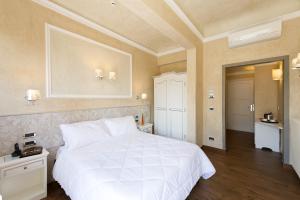 Postel nebo postele na pokoji v ubytování Hotel California