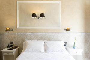 Postel nebo postele na pokoji v ubytování Hotel California