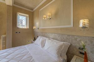Postel nebo postele na pokoji v ubytování Hotel California