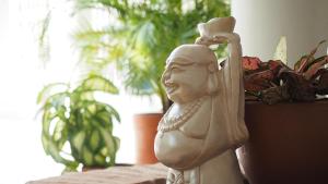 a statue of a woman sitting on top of a table at Hotel Casa Cytia in Cartagena de Indias