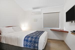 Tempat tidur dalam kamar di Discovery Parks - Coogee Beach