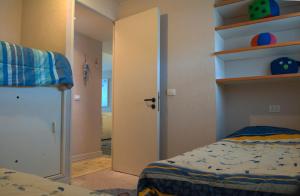 a room with a bedroom with a bed and shelves at San Alfonso del Mar Edificio Goleta in Algarrobo +47 photos