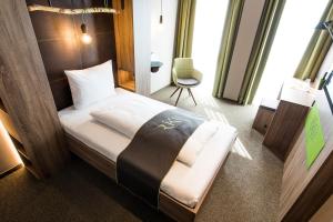 Postel nebo postele na pokoji v ubytování RiKu HOTEL Ulm