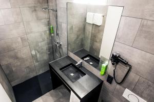 Koupelna v ubytování RiKu HOTEL Ulm