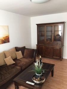 a living room with a couch and a coffee table at Apartment Jakimovski in Wuppertal