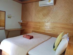 A bed or beds in a room at Dreamland Resort