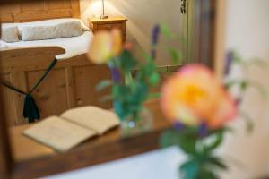 Postel nebo postele na pokoji v ubytování Agriturismo Maso Lizzone