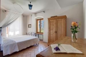 Postel nebo postele na pokoji v ubytování Agriturismo Maso Lizzone