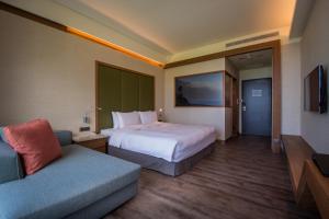 Postel nebo postele na pokoji v ubytování Taroko Liiko Hotels