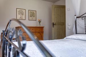 Postel nebo postele na pokoji v ubytování Agriturismo Maso Lizzone