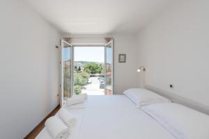 Postel nebo postele na pokoji v ubytování Apartment Maro Bayview