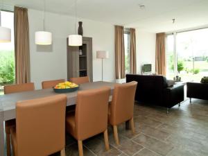 a kitchen and dining room with a table and chairs at Tail-Wagging Lake Escape in Heel