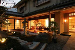 a house with a garden in front of it at Rangetsu in Kyoto
