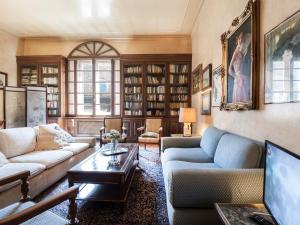 a living room with two couches and a coffee table at UR-NEST Strada Maggiore in Bologna