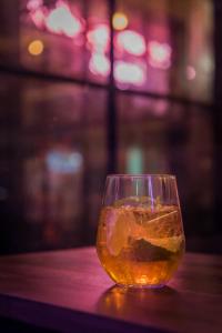 a glass of tea sitting on a table at Dreamcatcher Bangkok in Bangkok