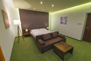 Posteľ alebo postele v izbe v ubytovaní Hotel Arkada
