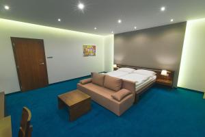 Posteľ alebo postele v izbe v ubytovaní Hotel Arkada