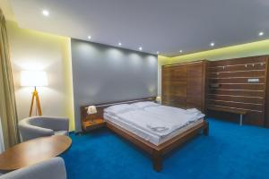 Posteľ alebo postele v izbe v ubytovaní Hotel Arkada