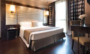 A bed or beds in a room at Uptown Palace