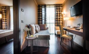 A bed or beds in a room at Uptown Palace