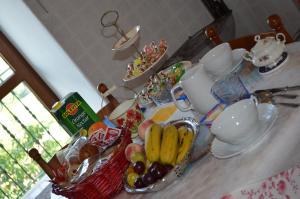 a counter with a bunch of fruit in baskets on it at Cà da Nonna in Pareto +8 photos
