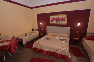 Postel nebo postele na pokoji v ubytování B&B Empedocle