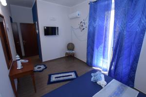 TV a/nebo společenská místnost v ubytování B&B Empedocle